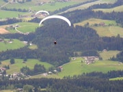 Athletes paragliding in Kitzbühel